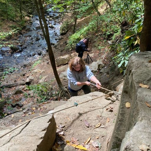 Mary Ellen climbing down to the base of Soco Falls