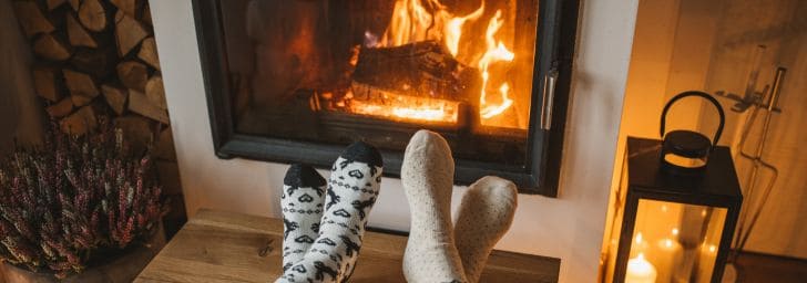Relaxing in sock feet in front of the fireplace