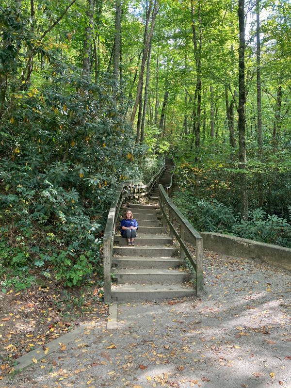 Mary Ellen sitting on stairs at Mingo Falls