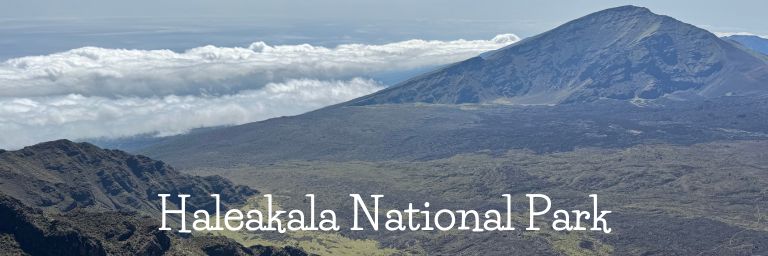 Mountain rising above the clouds on a hazy day