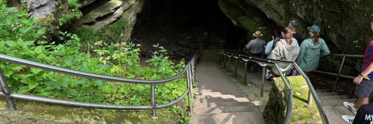 Tourists following a park ranger into Mammoth Cave on a tour
